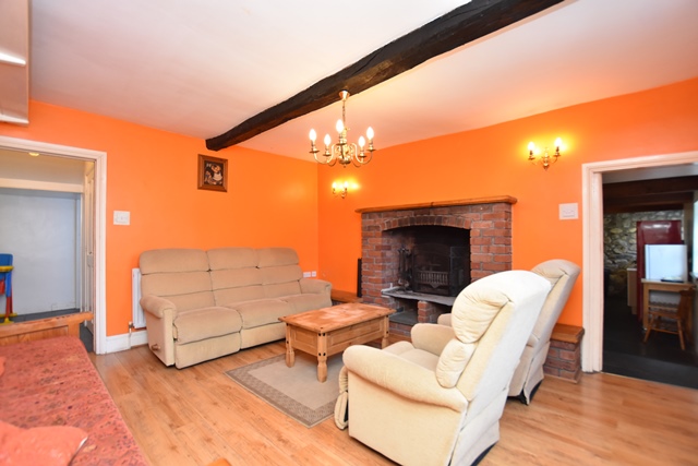 Sitting room: with open fire, beams and wooden floor.